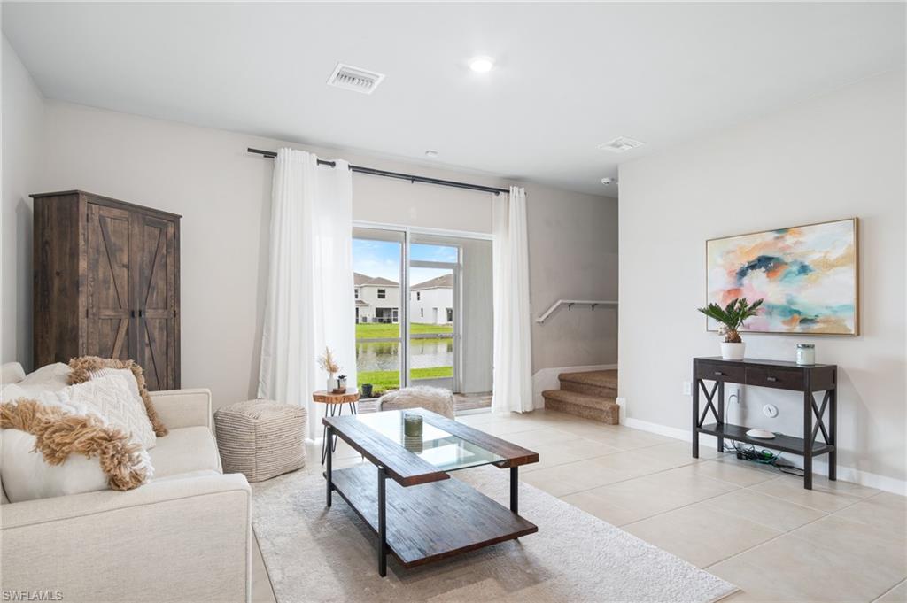 15070 Wildflower Circle Naples, FL 34119 - Photo 9 of 22 a living room with furniture and a window