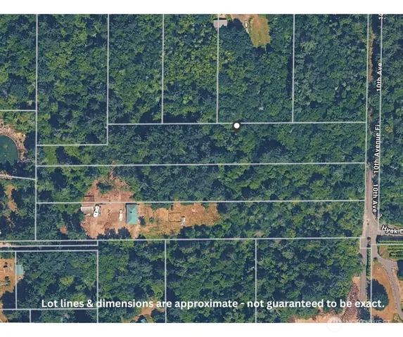 a aerial view of a house with a yard
