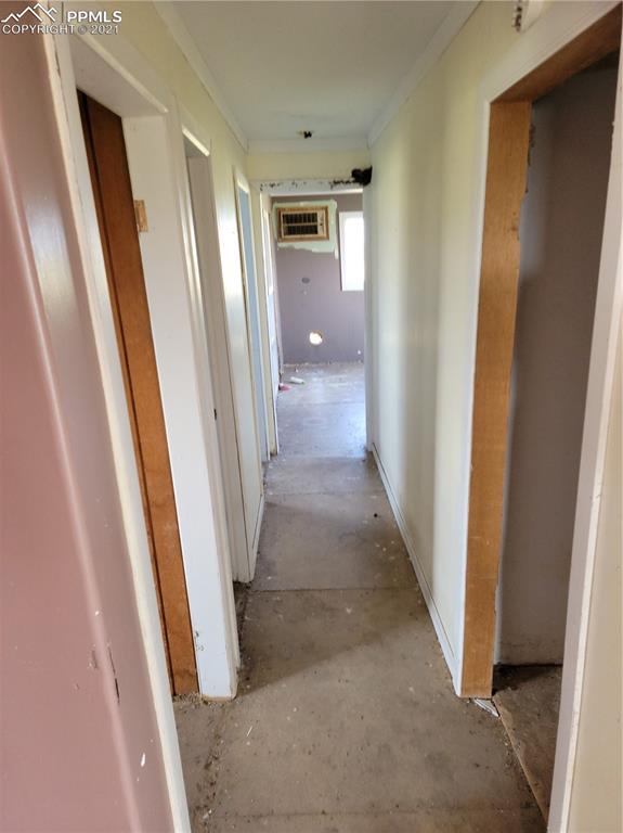 40915 Funk Road Ramah, CO 80832 - Photo 13 of 23 a view of a hallway with wooden cabinets and stairs