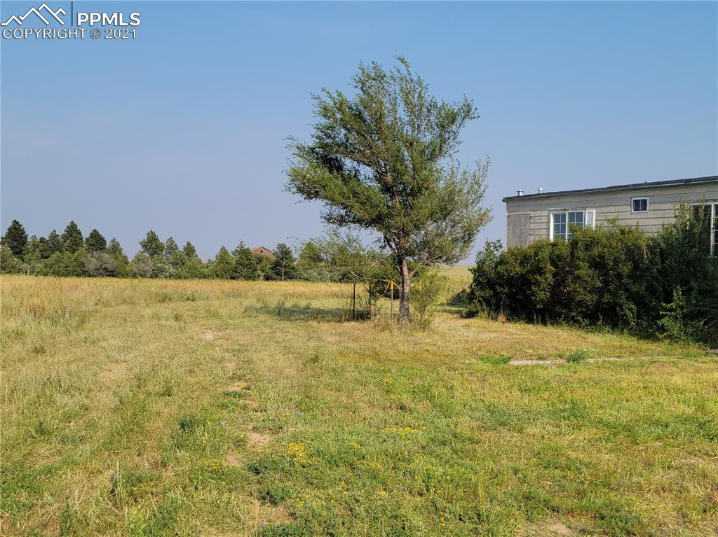40915 Funk Road Ramah, CO 80832 - Photo 3 of 23 a view of a lake with a building in the background