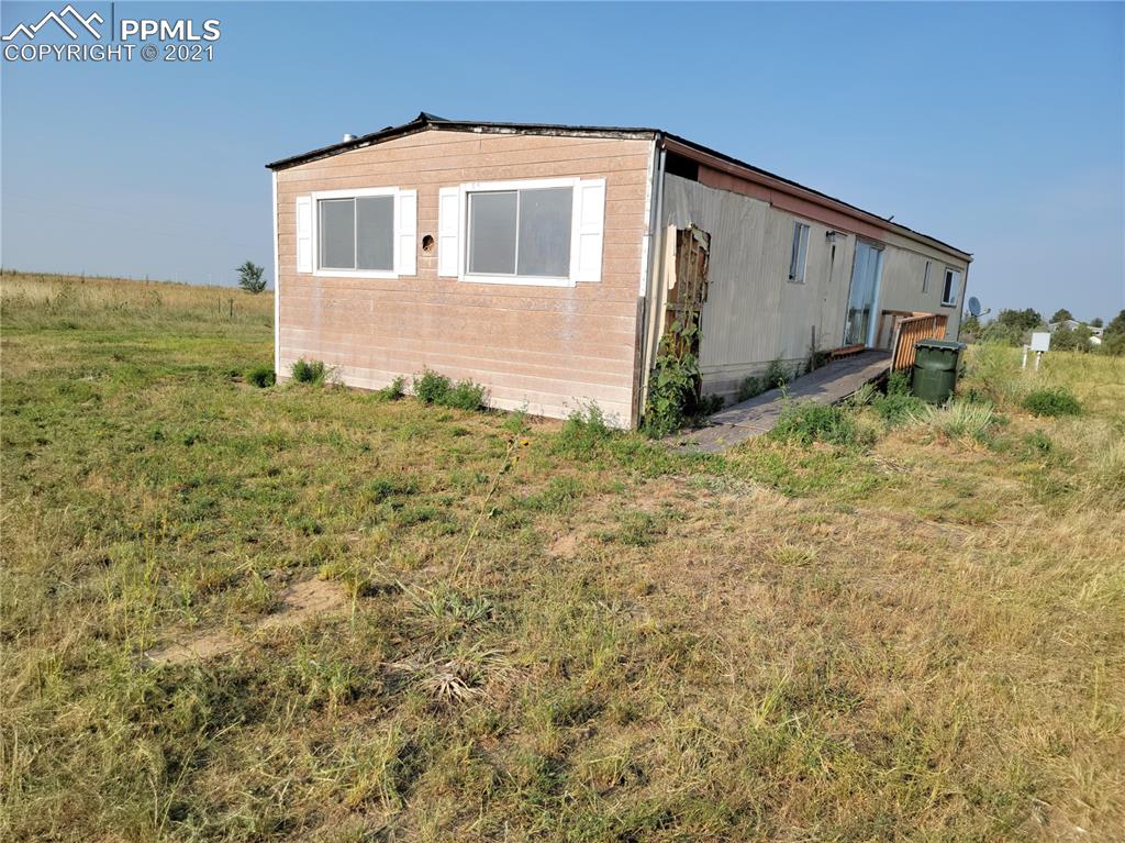40915 Funk Road Ramah, CO 80832 - Photo 10 of 23 a front view of a house with a yard