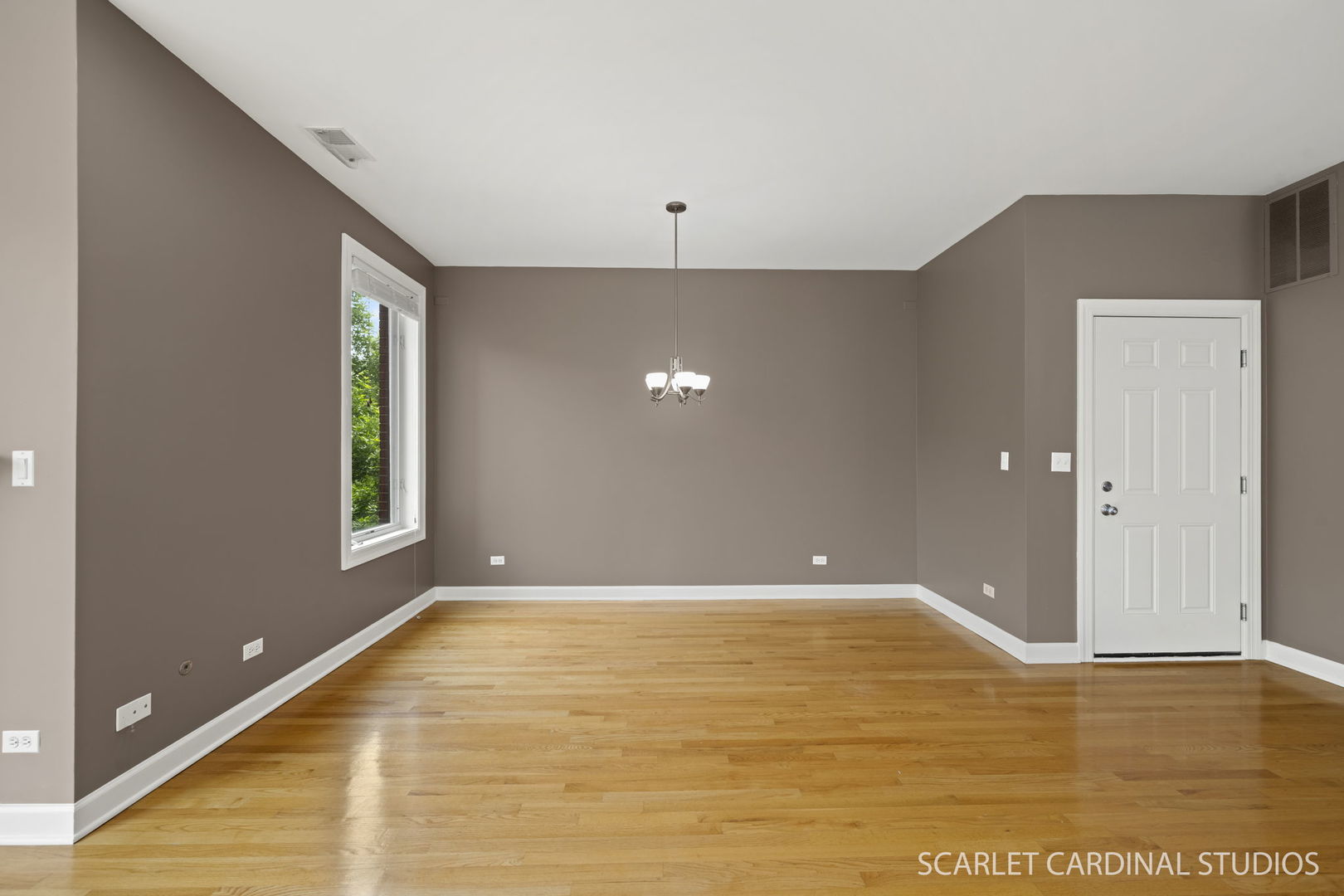 1419 West Fillmore Street, Unit 3W Chicago, IL 60607 - Photo 9 of 26 a view of an empty room with window and wooden floor