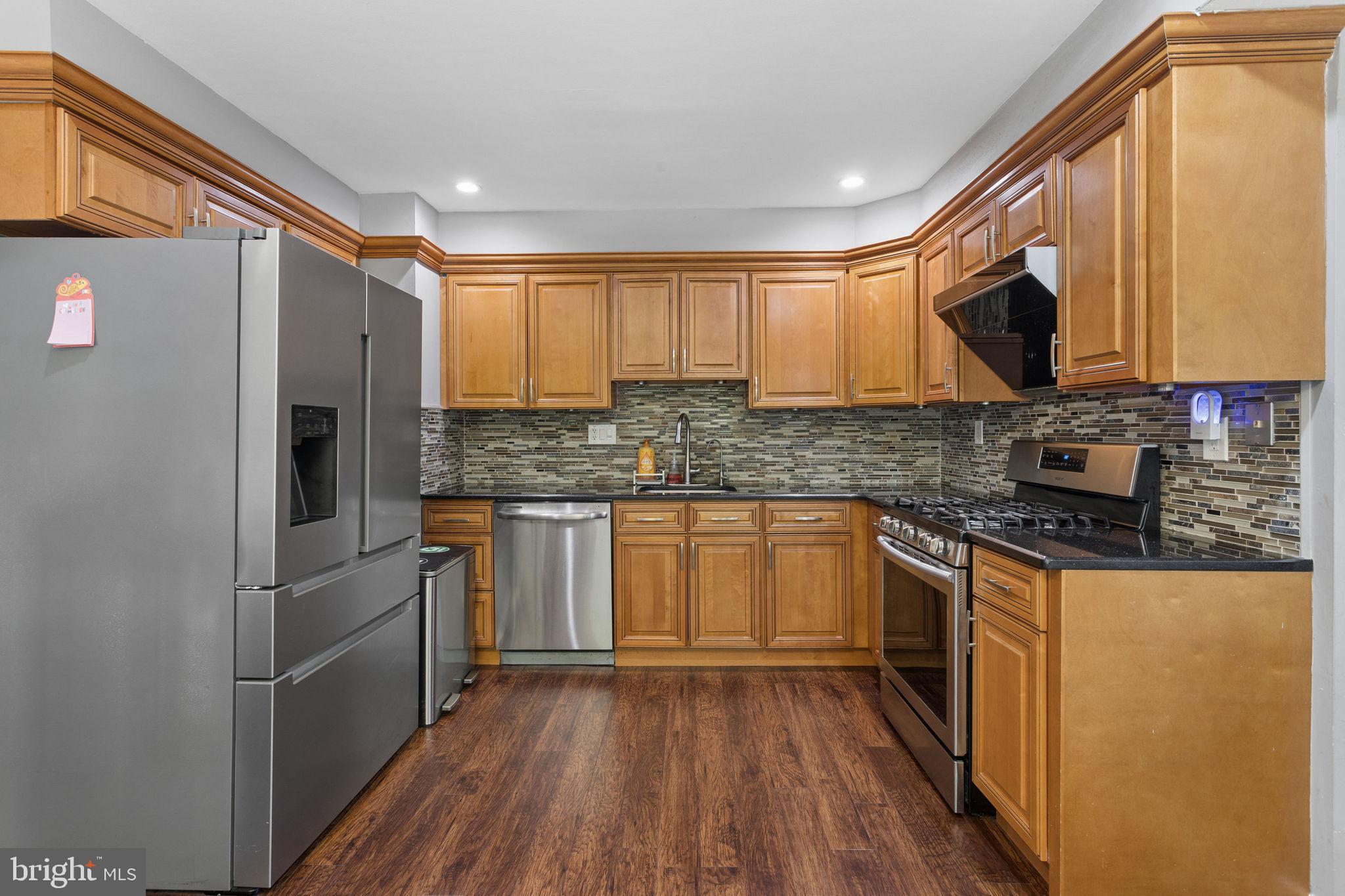 252 Sandringham Road Cherry Hill, NJ 08003 - Photo 10 of 31 a kitchen with stainless steel appliances a microwave sink and cabinets