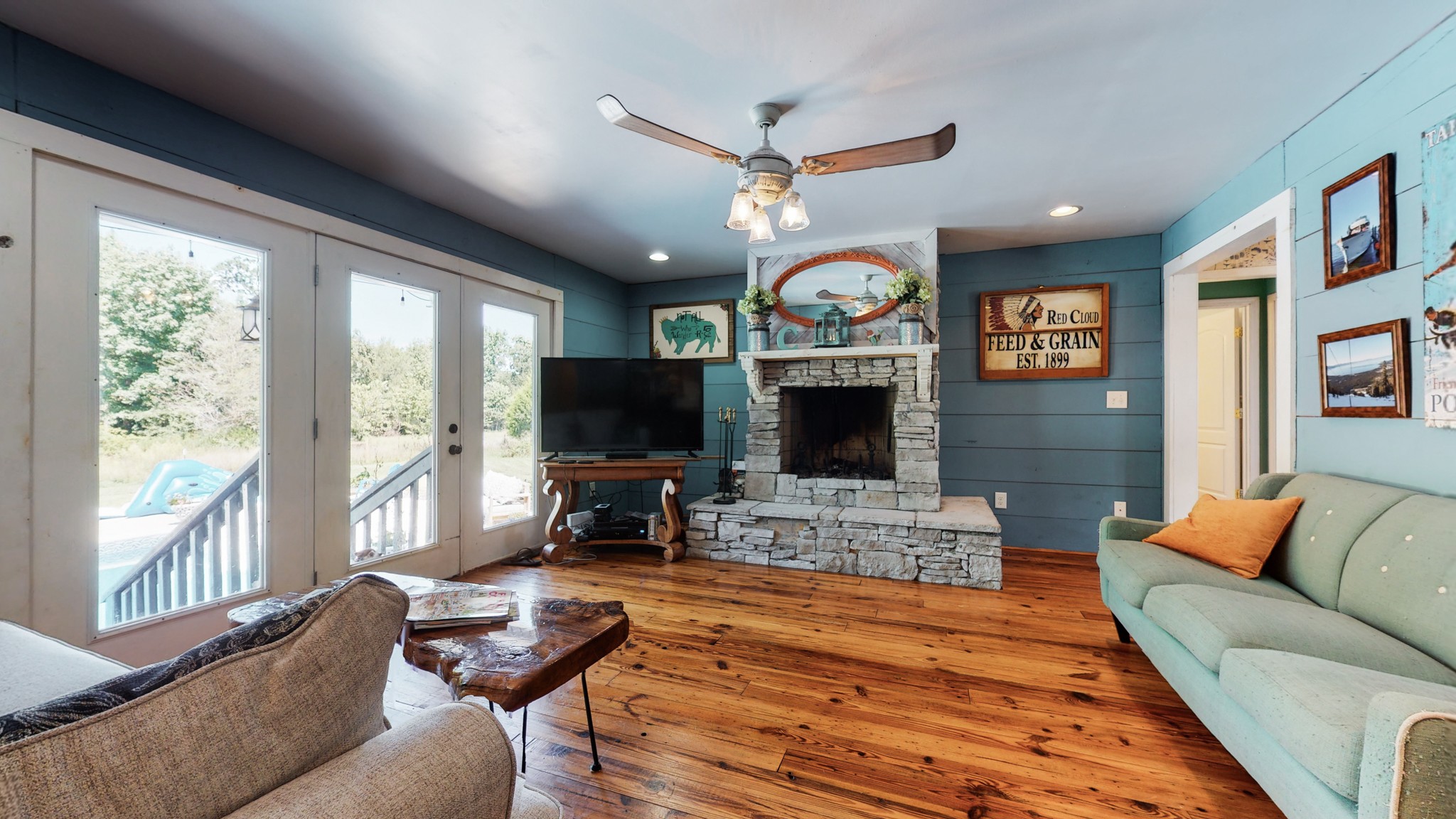 729 Dabbsy Ford Road Decherd, TN 37324 - Photo 11 of 25 a living room with furniture a flat screen tv and a large window