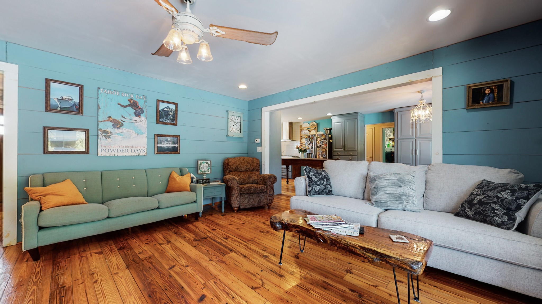729 Dabbsy Ford Road Decherd, TN 37324 - Photo 12 of 25 a living room with furniture a couch and paintings on the wall