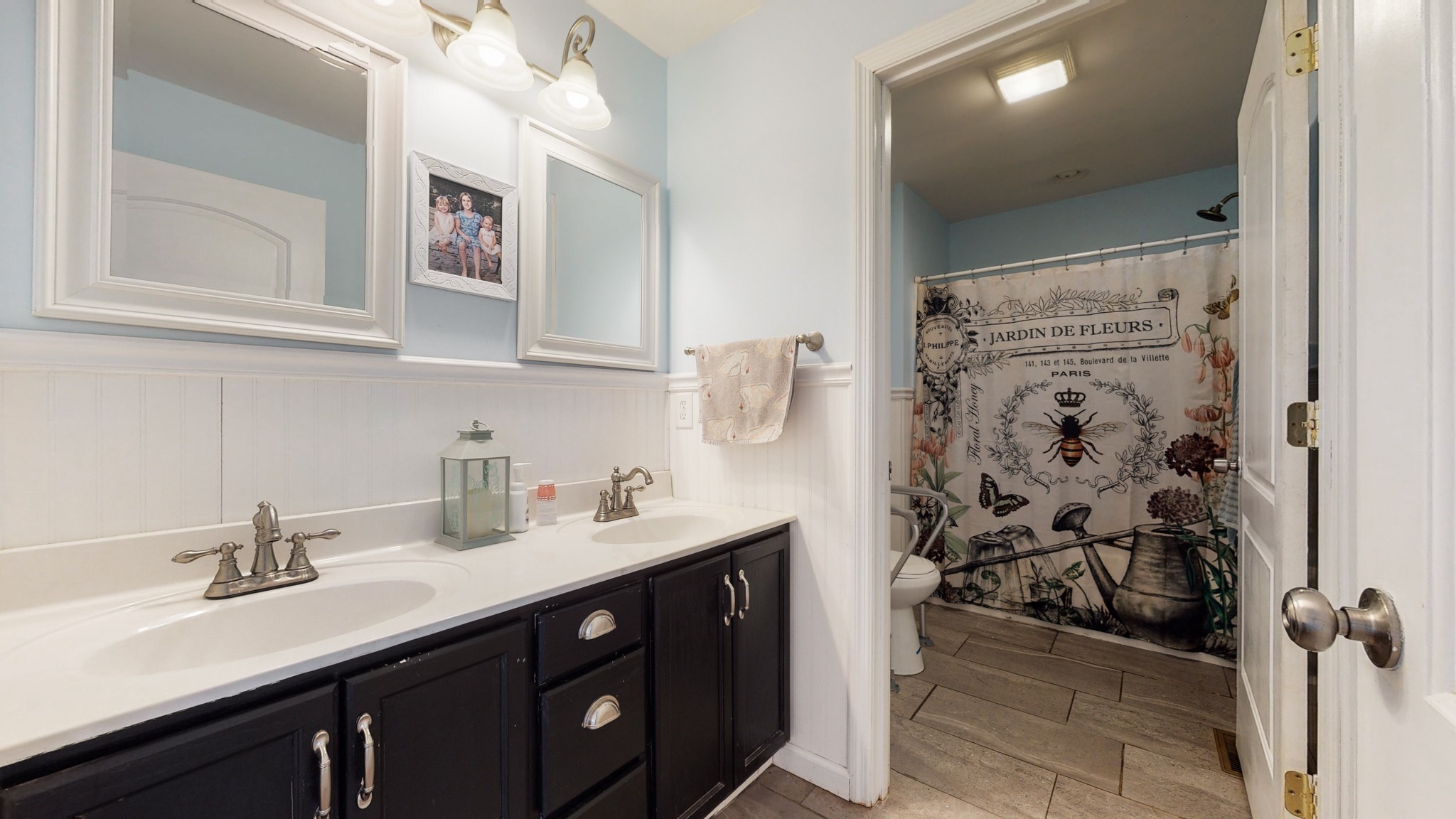 729 Dabbsy Ford Road Decherd, TN 37324 - Photo 21 of 25 a bathroom with a double vanity sink a mirror and shower