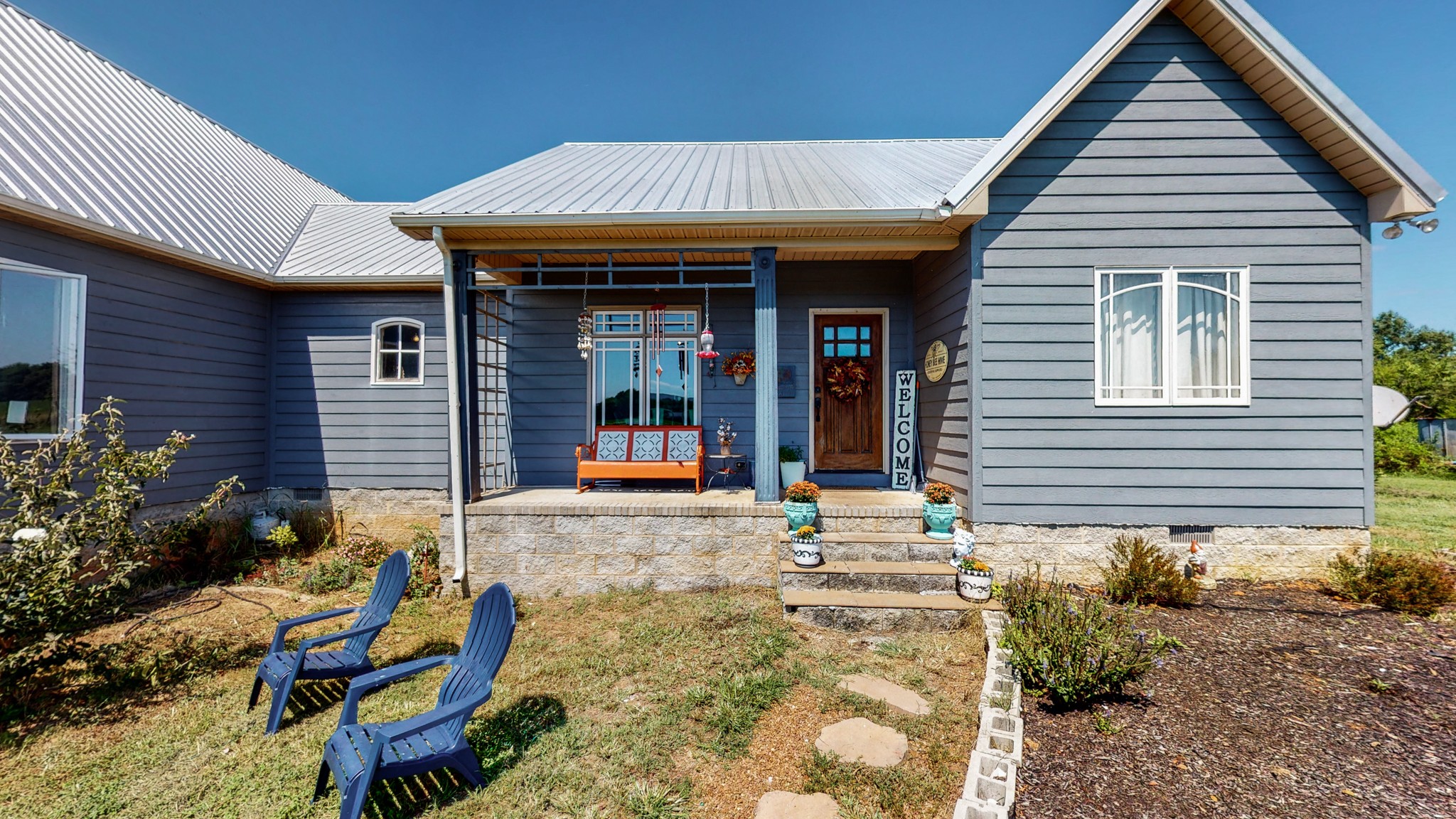 729 Dabbsy Ford Road Decherd, TN 37324 - Photo 5 of 25 a view of a house with potted plants