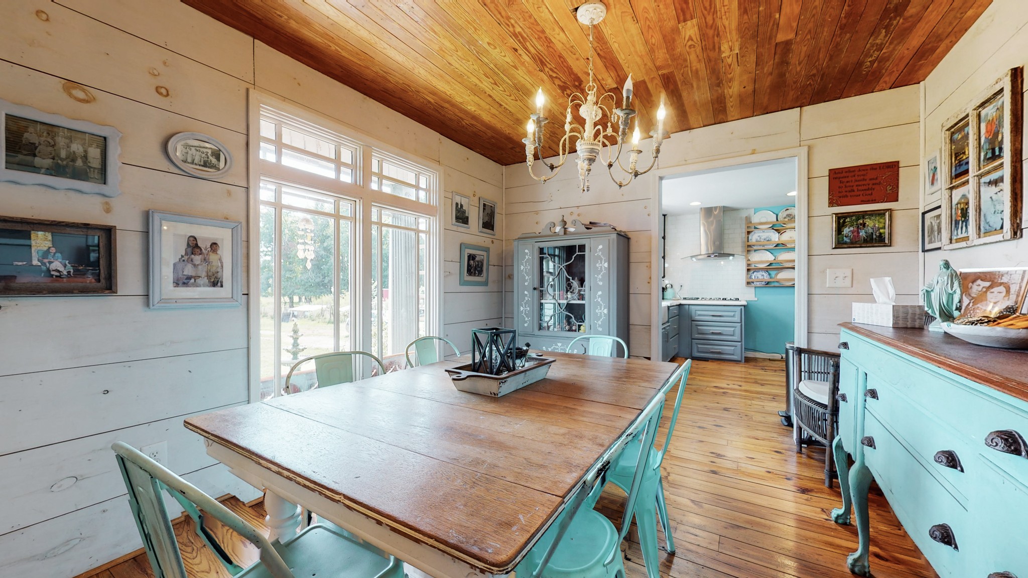 729 Dabbsy Ford Road Decherd, TN 37324 - Photo 8 of 25 a view of a dining room with furniture a chandelier and wooden floor