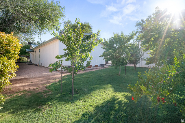 236 West 300 South Hurricane, UT 84737 - Photo 68 of 76 Expansive grassy area featuring multiple young trees and established perimeter foliage