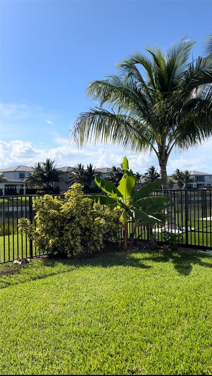 17267 Windy Pointe Lane Boca Raton, FL 33496 - Photo 22 of 47 a front view of multi story residential apartment building with yard and green space