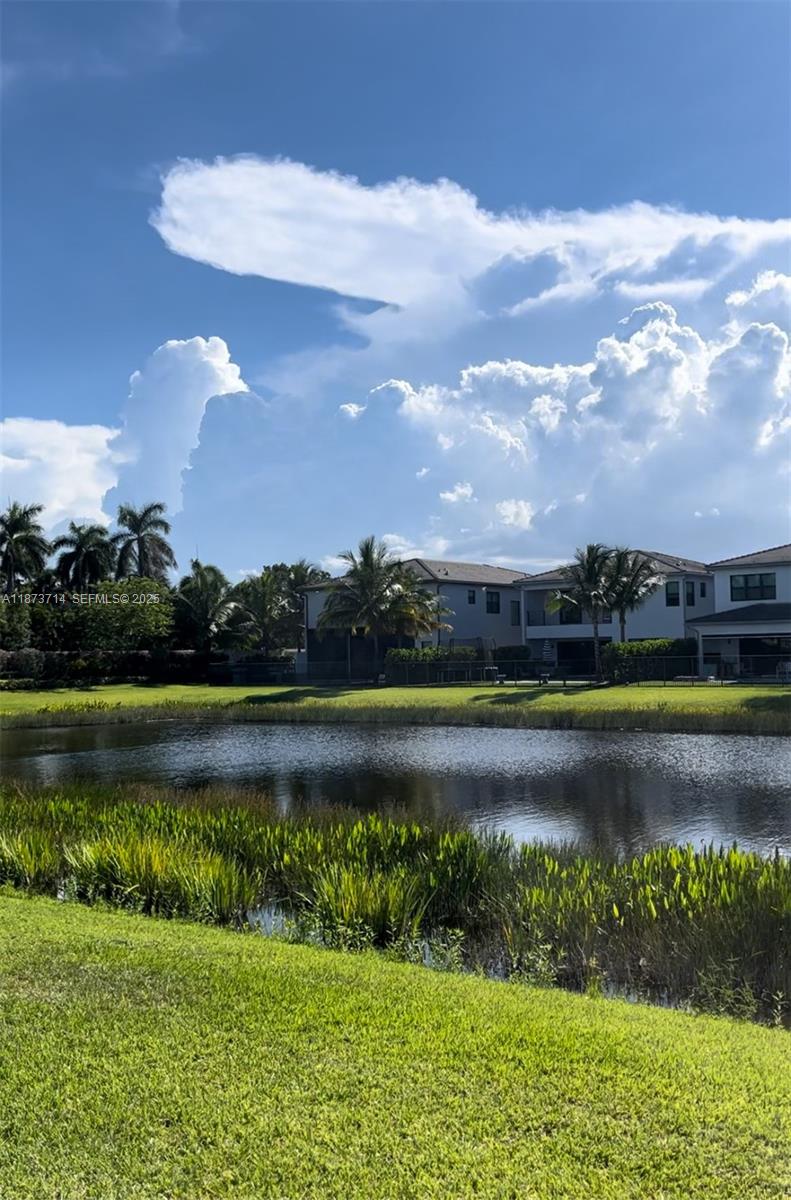 17267 Windy Pointe Lane Boca Raton, FL 33496 - Photo 24 of 47 a view of a lake with a big yard