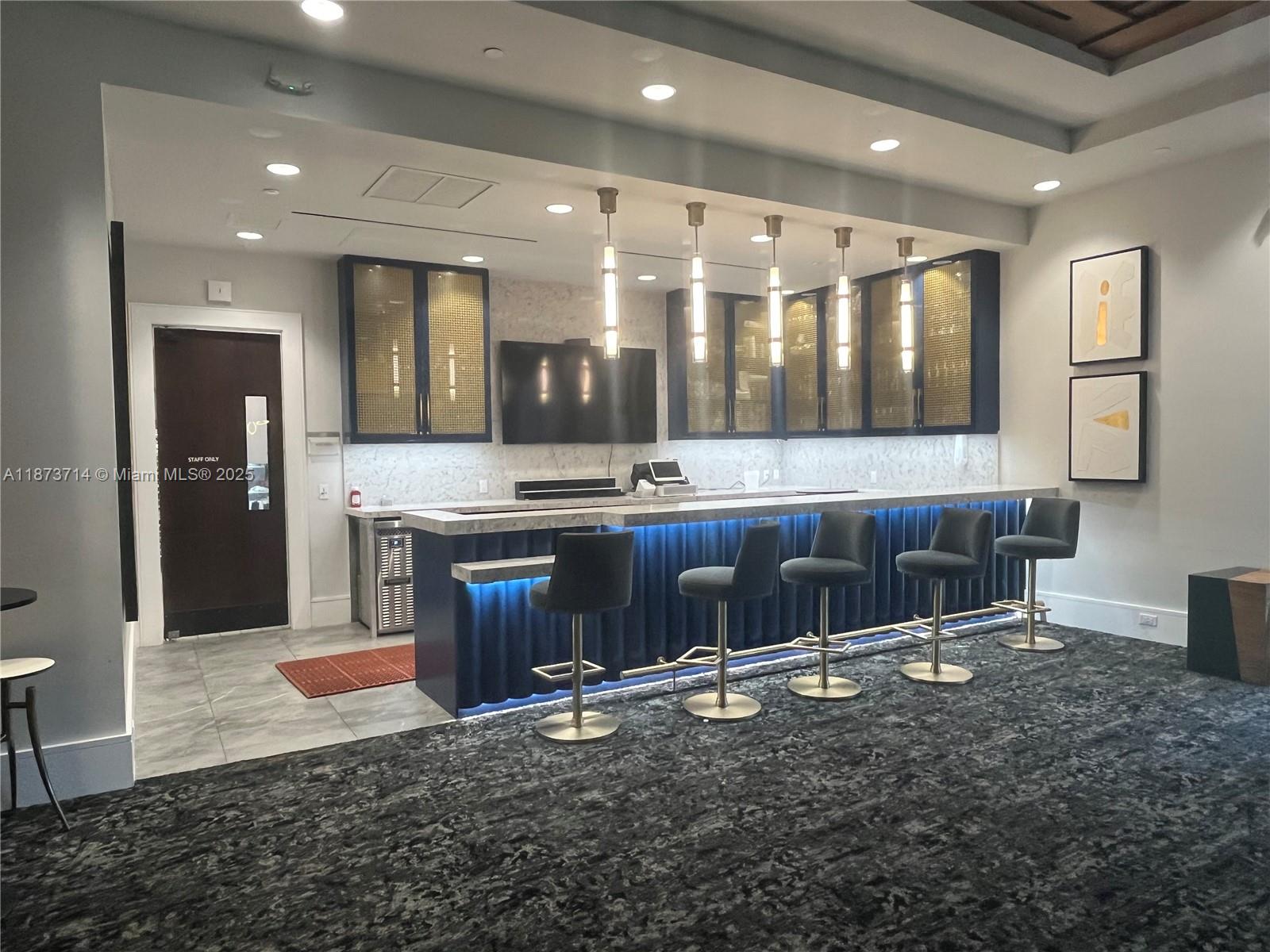 17267 Windy Pointe Lane Boca Raton, FL 33496 - Photo 29 of 47 a living room with stainless steel appliances kitchen island granite countertop wooden cabinets and a granite counter tops