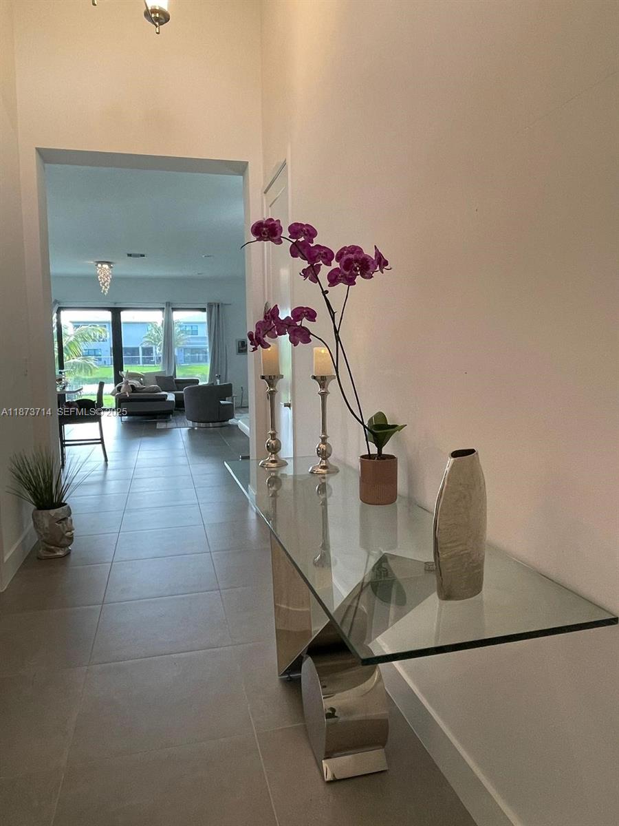 17267 Windy Pointe Lane Boca Raton, FL 33496 - Photo 3 of 47 a view of a room with gym equipment