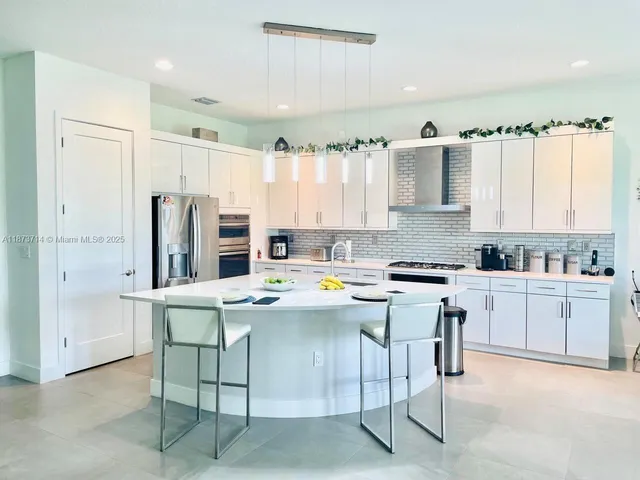 a kitchen with counter top space cabinets and stainless steel appliances