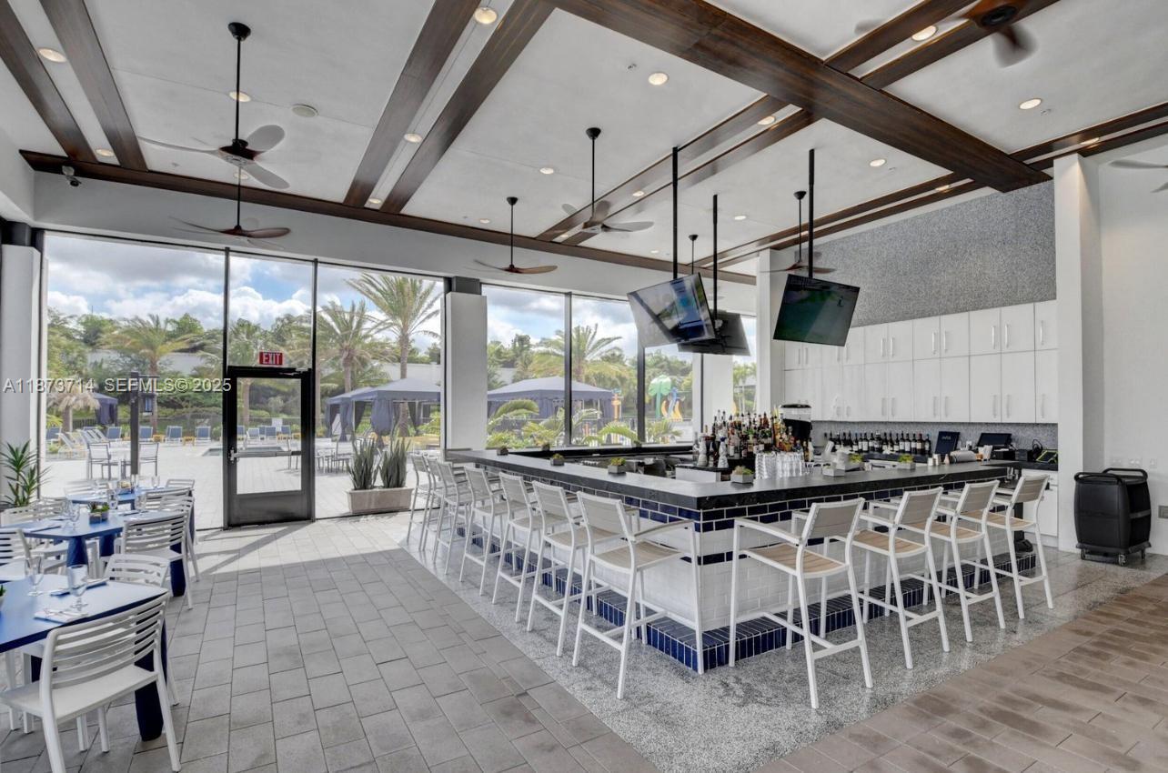 17267 Windy Pointe Lane Boca Raton, FL 33496 - Photo 44 of 47 a large kitchen with a table and chairs