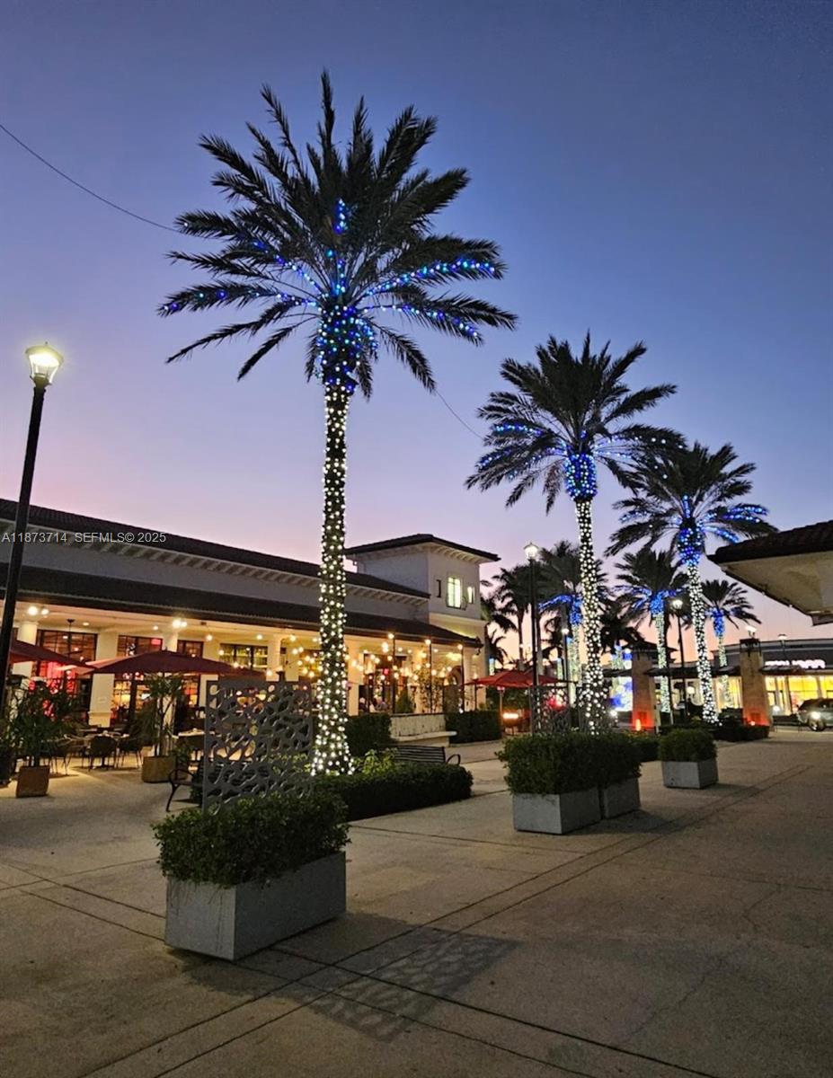 17267 Windy Pointe Lane Boca Raton, FL 33496 - Photo 45 of 47 a view of a very nice looking living room with a large window and potted plants