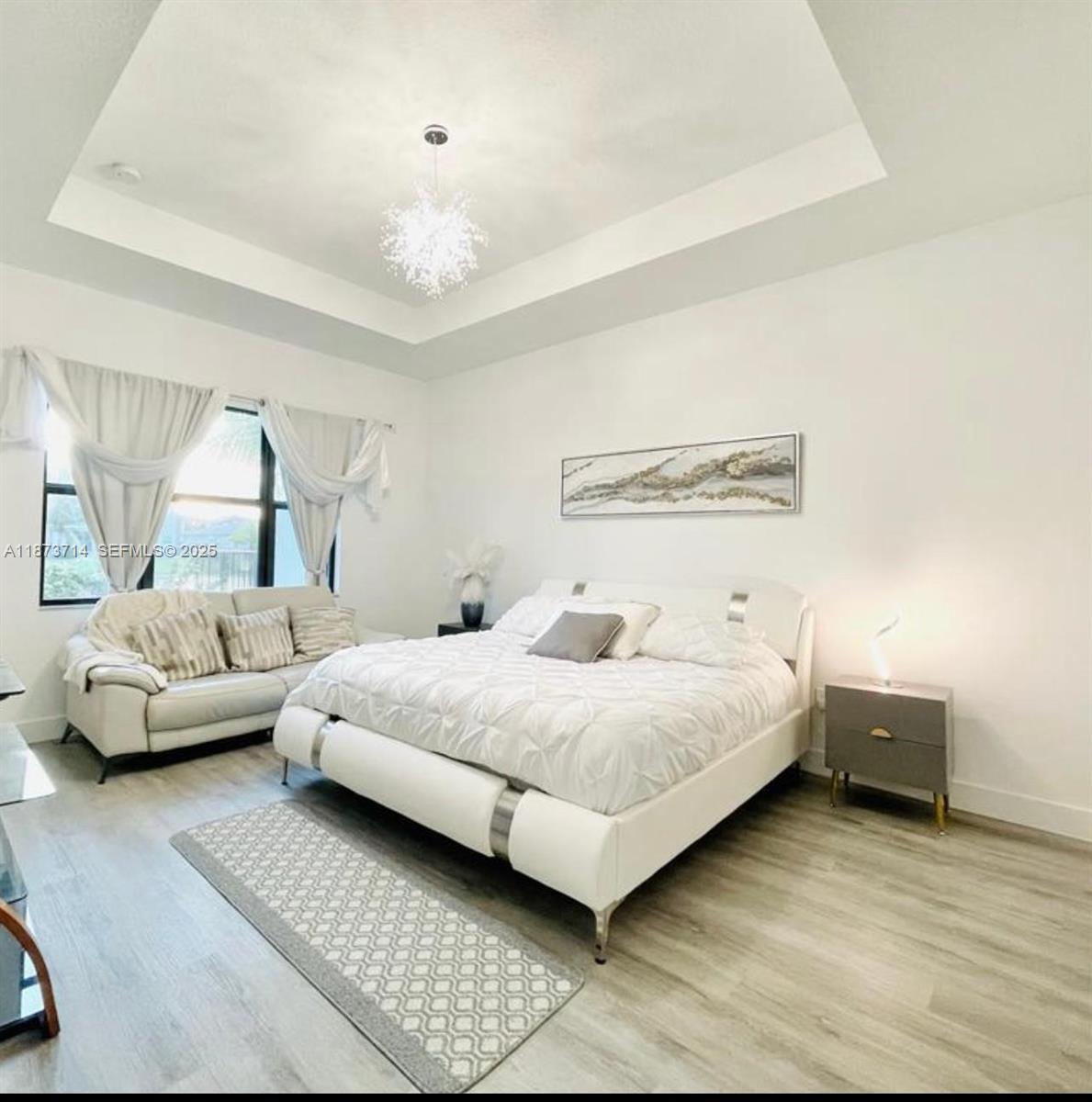 17267 Windy Pointe Lane Boca Raton, FL 33496 - Photo 10 of 47 a bedroom with a bed and a couch