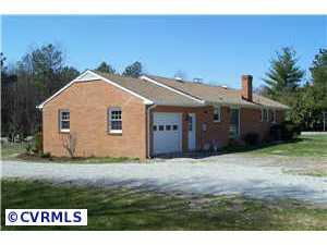 9312 Reams Road Richmond, VA 23236 - Photo 2 of 10 a view of a house with a yard