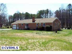 9312 Reams Road Richmond, VA 23236 - Photo 4 of 10 a view of house with garden space and trees