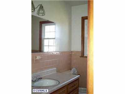 9312 Reams Road Richmond, VA 23236 - Photo 9 of 10 a bathroom with a sink and a toilet