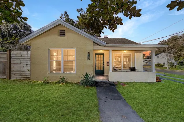 a front view of house with yard and green space