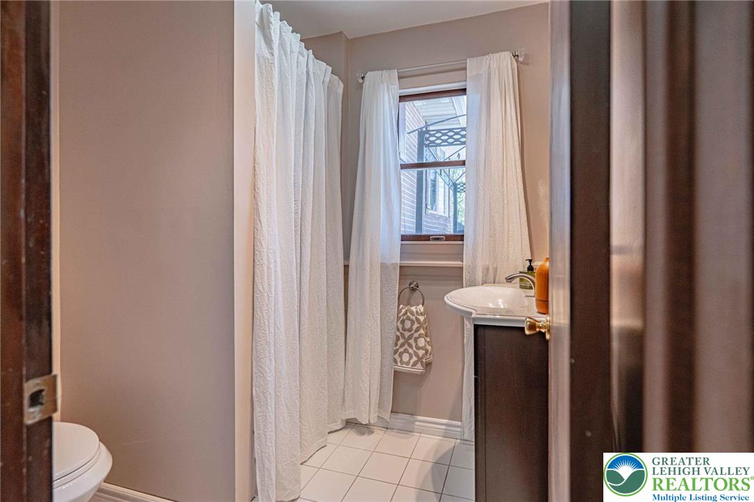 3857 Friedens Road Slatington, PA 18080 - Photo 24 of 75 This bathroom features a sleek vanity and a well-lit shower area.