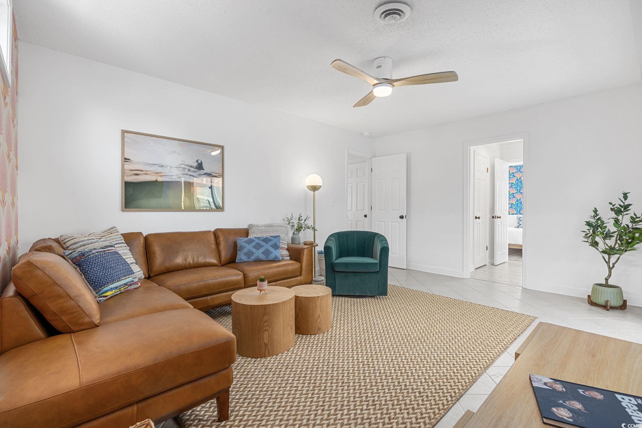 104 Ash Street North Myrtle Beach, SC 29582 - Photo 14 of 39 Living area featuring tile patterned floors and ceiling fan