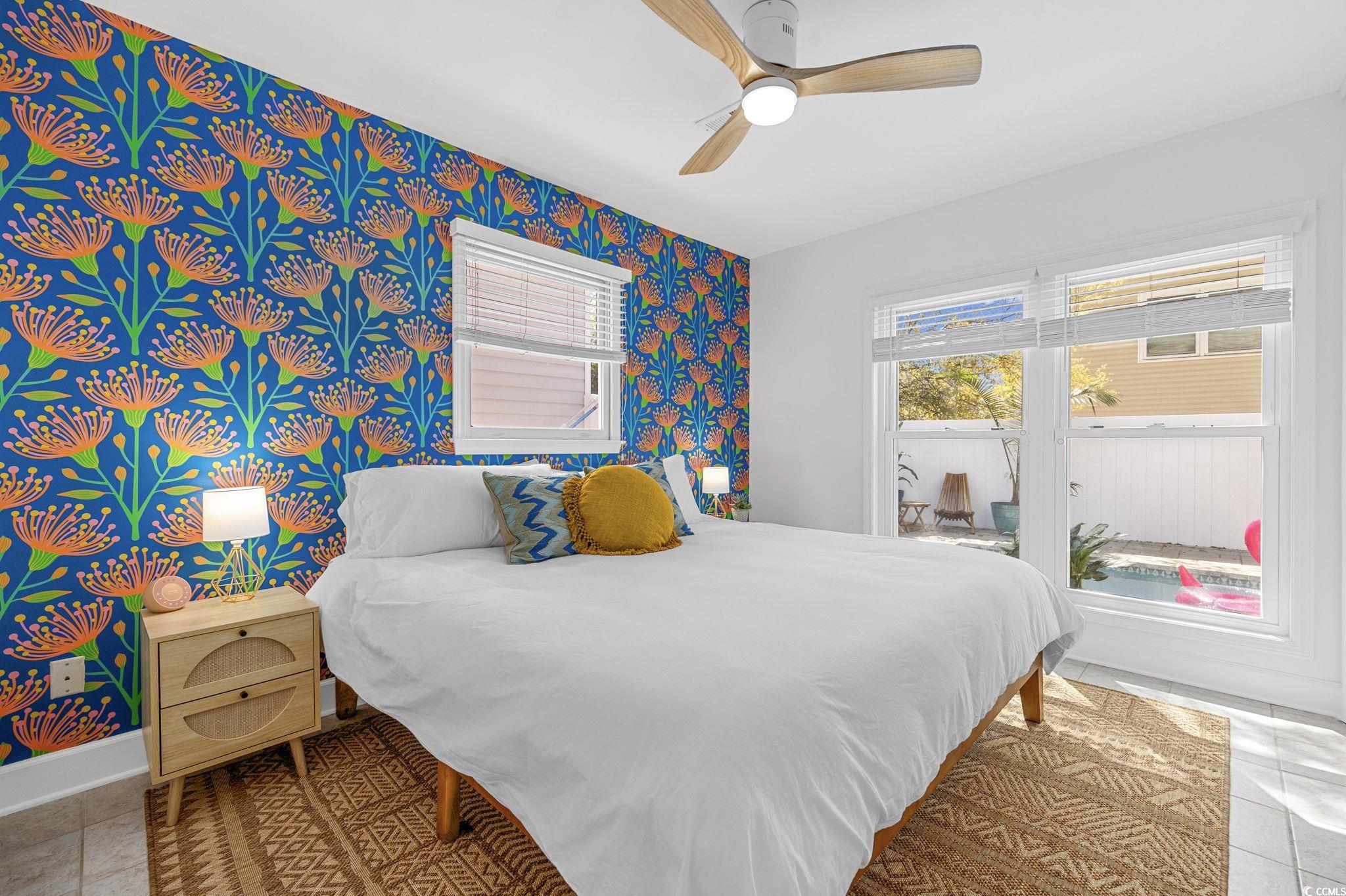104 Ash Street North Myrtle Beach, SC 29582 - Photo 25 of 39 Bedroom featuring light tile patterned floors, ceiling fan, and wallpapered walls
