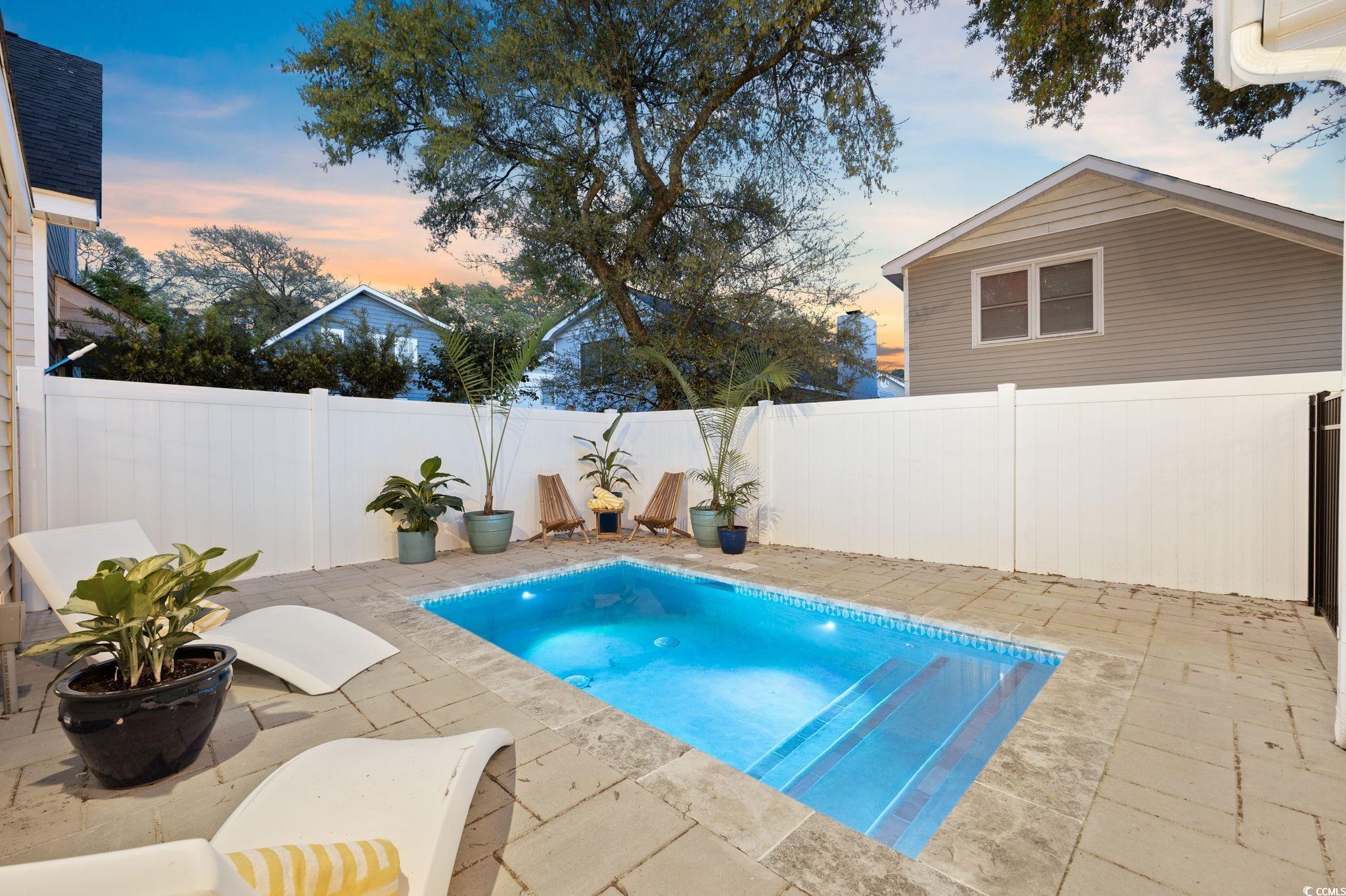 104 Ash Street North Myrtle Beach, SC 29582 - Photo 33 of 39 View of pool with a fenced backyard and a patio