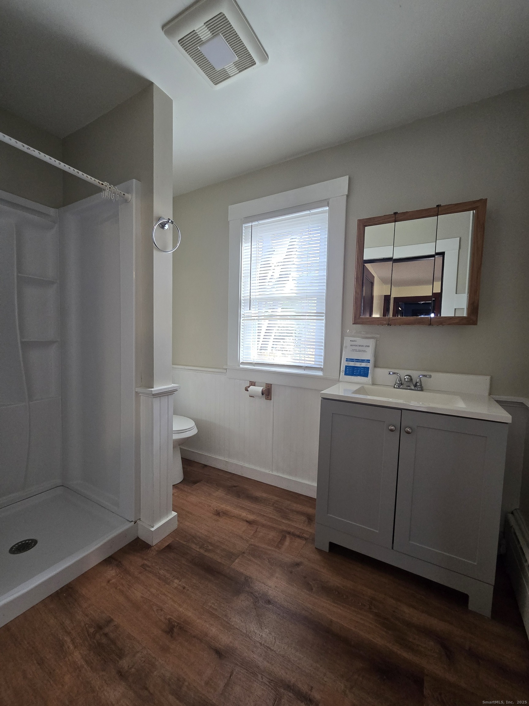 19 Downer Street Stonington, CT 06379 - Photo 11 of 13 a bathroom with a sink toilet and shower