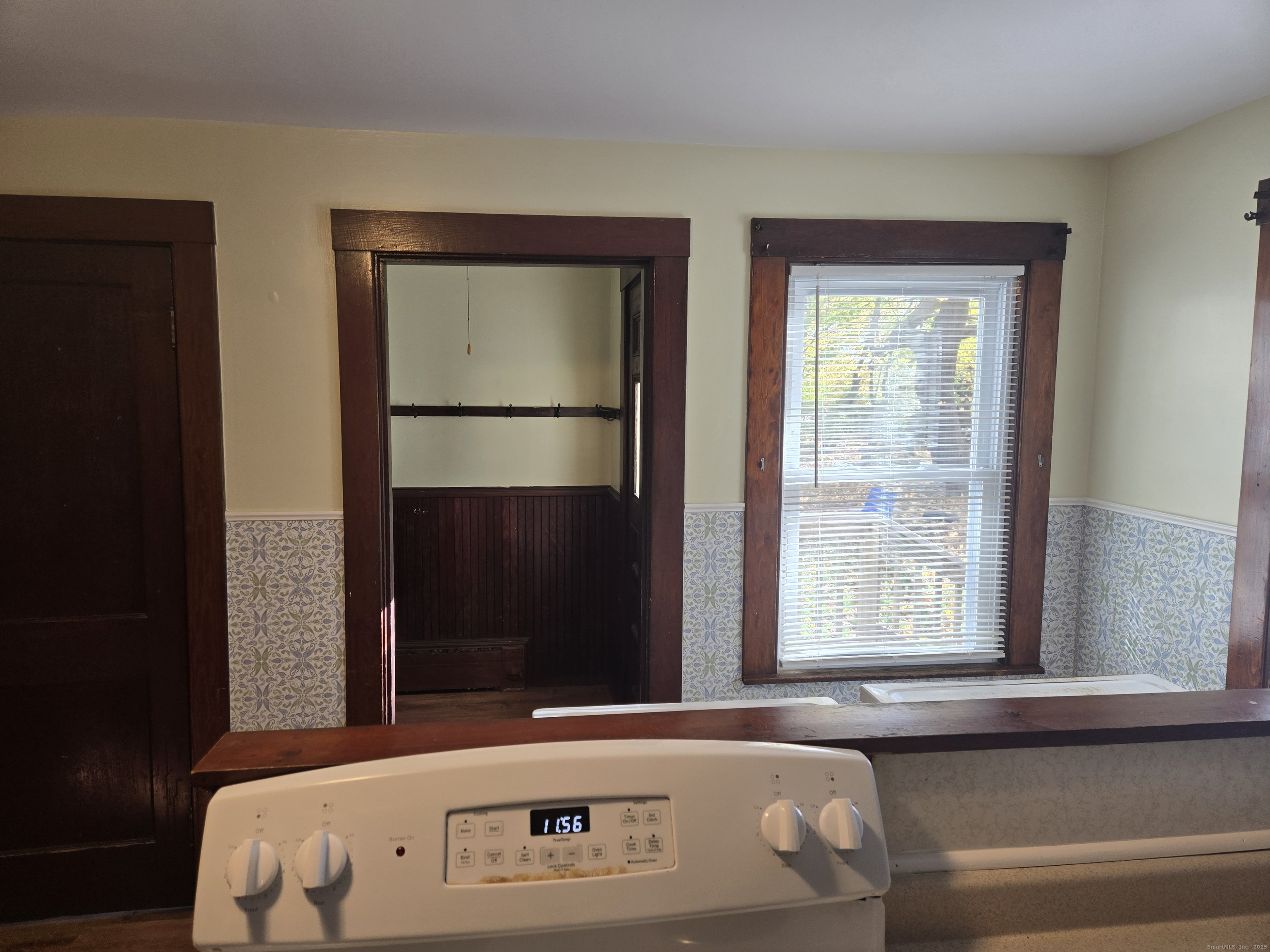 19 Downer Street Stonington, CT 06379 - Photo 9 of 13 a bathroom with a bathtub and a window