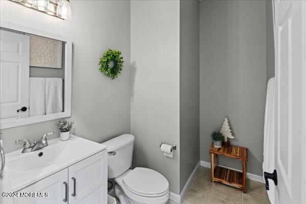 19 Popper Street Manahawkin, NJ 08050 - Photo 11 of 53 a bathroom with a sink a toilet and vanity
