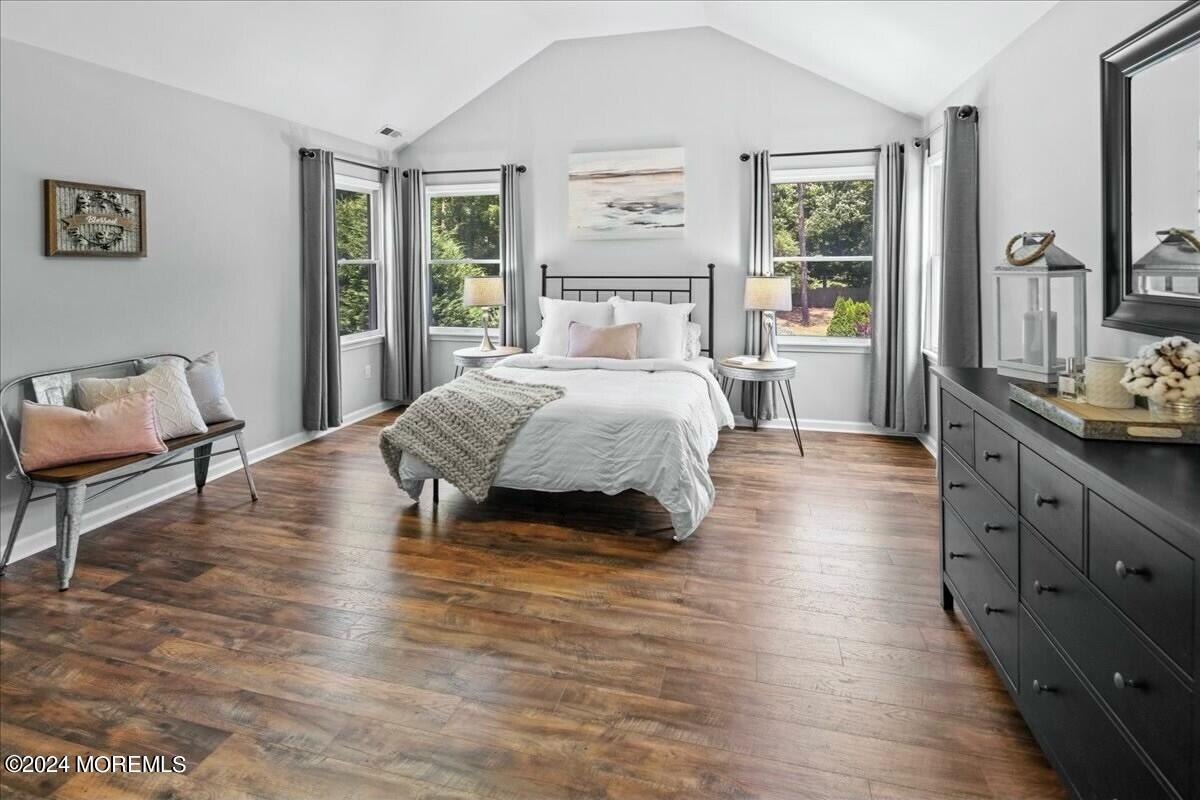 19 Popper Street Manahawkin, NJ 08050 - Photo 20 of 53 a bedroom with a bed and large windows