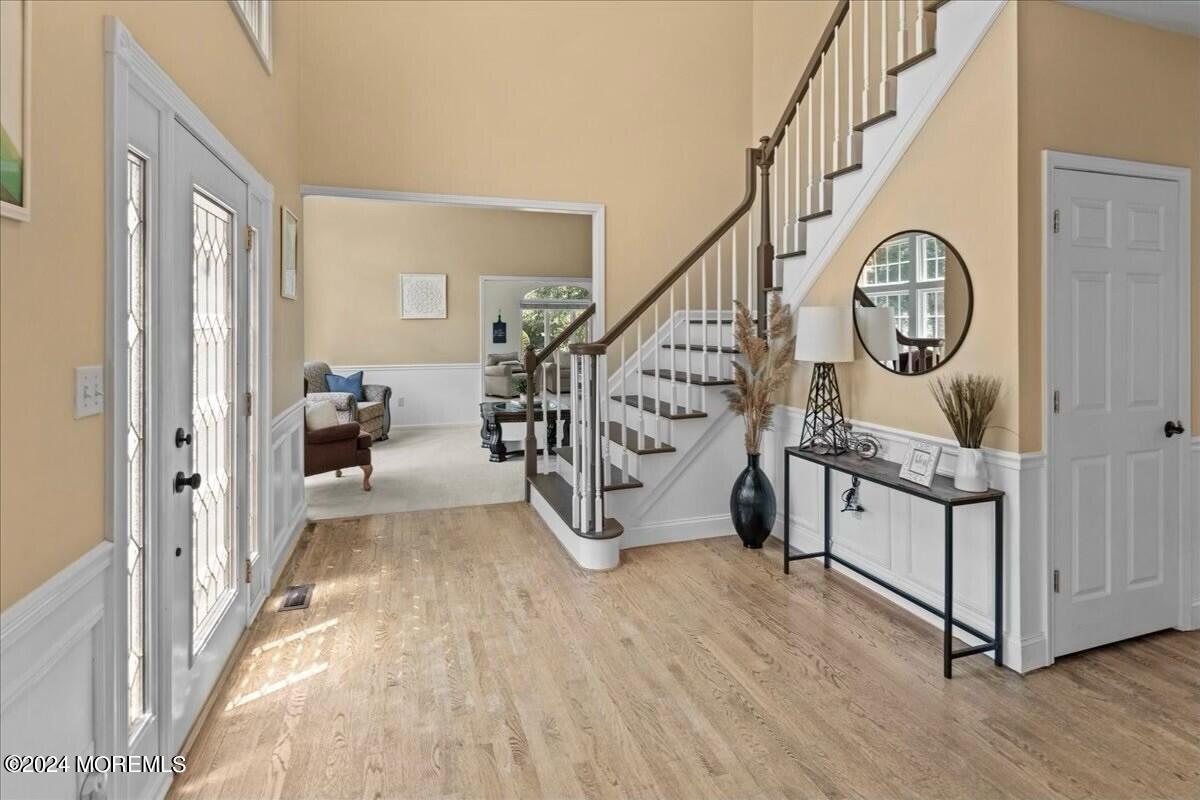 19 Popper Street Manahawkin, NJ 08050 - Photo 2 of 53 a view of an entryway with wooden floor and windows
