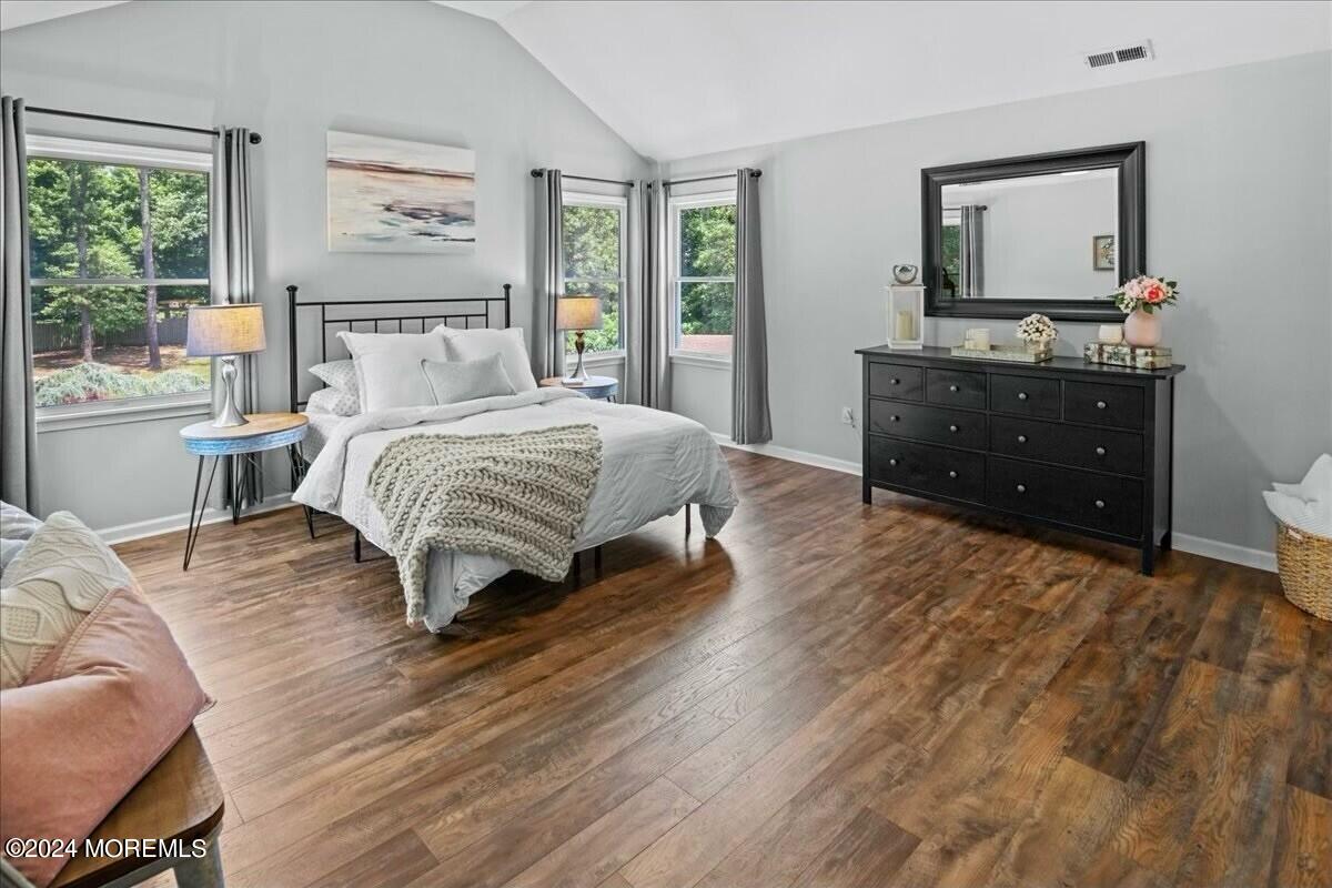 19 Popper Street Manahawkin, NJ 08050 - Photo 21 of 53 a bedroom with a bed and a dresser next to a window