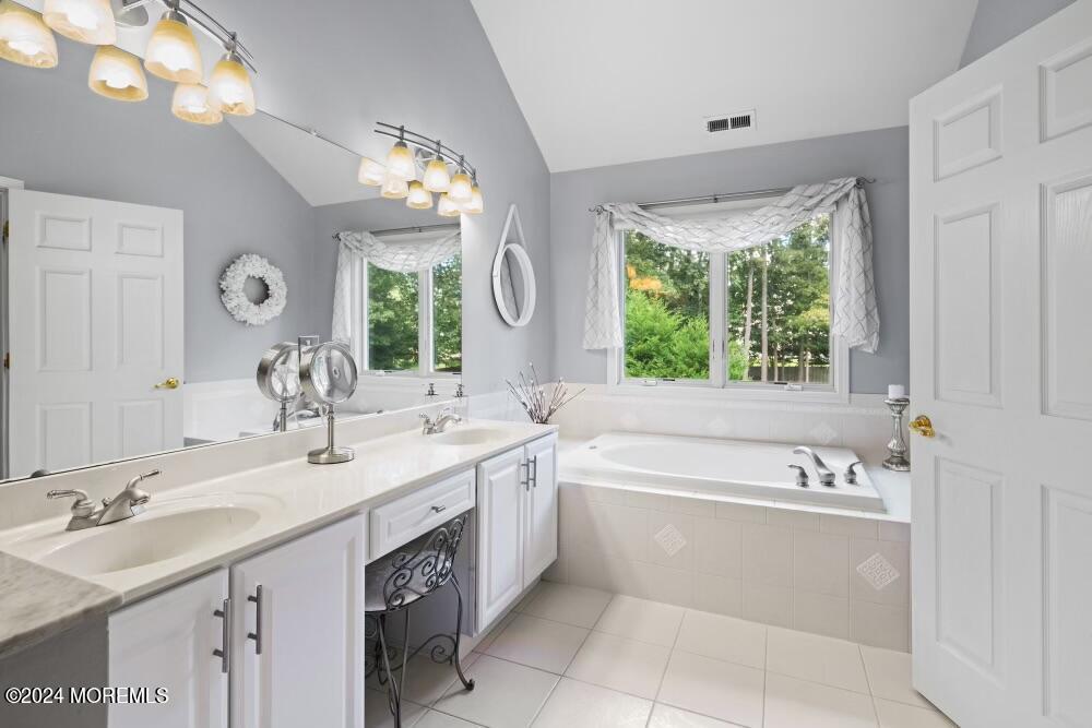 19 Popper Street Manahawkin, NJ 08050 - Photo 23 of 53 a bathroom with a sink double vanity and a bathtub