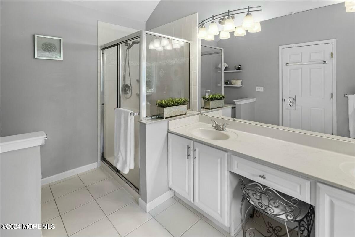 19 Popper Street Manahawkin, NJ 08050 - Photo 24 of 53 a spacious bathroom with a double vanity sink a mirror and a shower