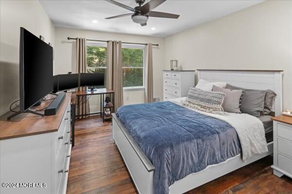 19 Popper Street Manahawkin, NJ 08050 - Photo 28 of 53 a bedroom with a bed and a flat screen tv