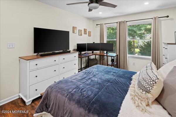 19 Popper Street Manahawkin, NJ 08050 - Photo 30 of 53 a bedroom with a bed and a flat screen tv