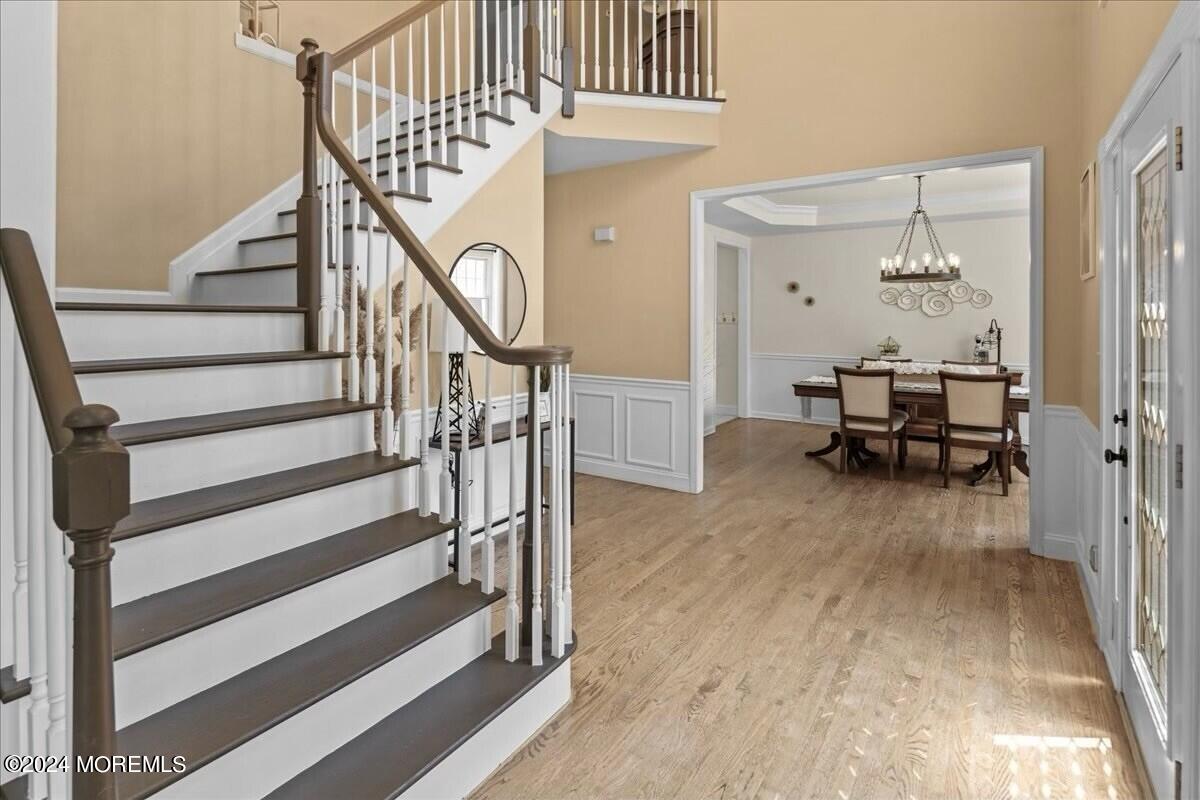 19 Popper Street Manahawkin, NJ 08050 - Photo 3 of 53 a view of dining room with wooden floor and white walls
