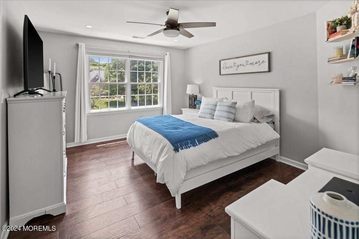 19 Popper Street Manahawkin, NJ 08050 - Photo 32 of 53 a bedroom with a bed and a flat screen tv