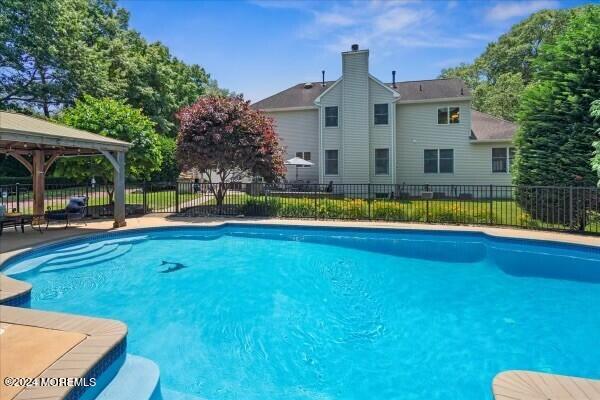 19 Popper Street Manahawkin, NJ 08050 - Photo 39 of 53 a view of a house with swimming pool and a yard