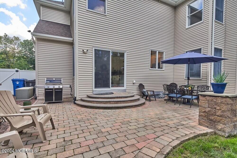 19 Popper Street Manahawkin, NJ 08050 - Photo 45 of 53 a backyard of a house with seating space