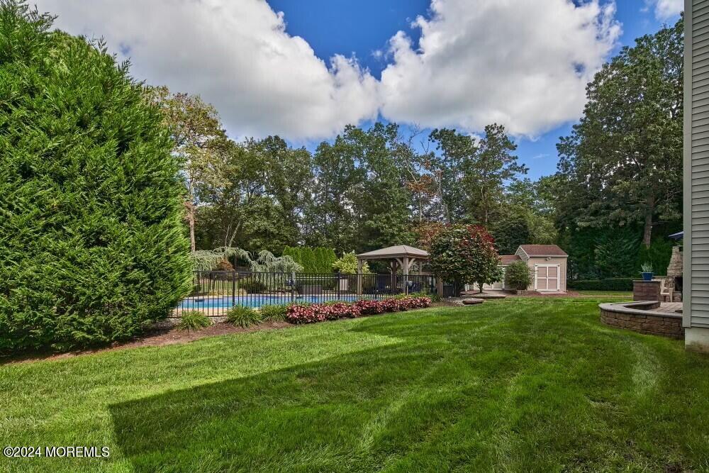 19 Popper Street Manahawkin, NJ 08050 - Photo 48 of 53 a view of a chair and table of the garden