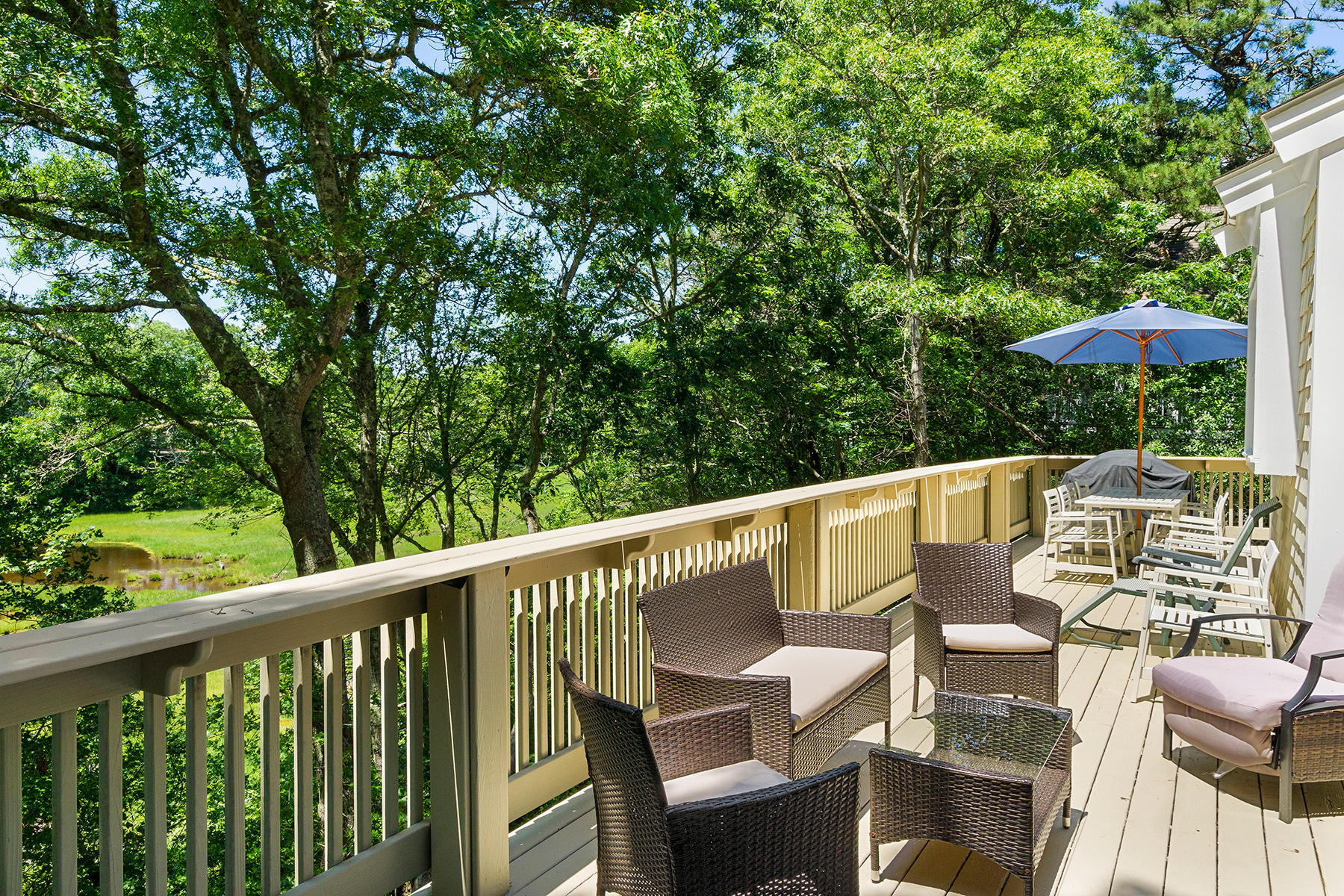 48 Summersea Road Mashpee, MA 02649 - Photo 3 of 41 a balcony with wooden floor and outdoor seating
