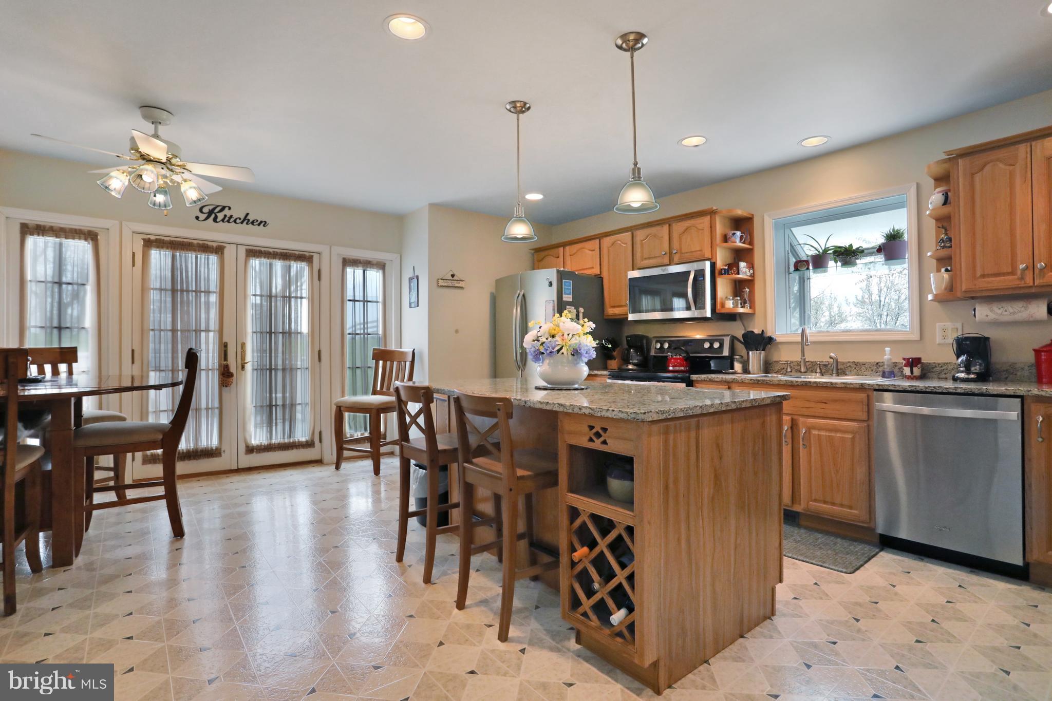11490 Rhapsody Road Greencastle, PA 17225 - Photo 7 of 30 Island offers additional seating and wine rack