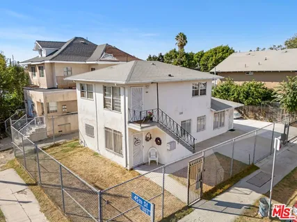 a front view of a house with large windows