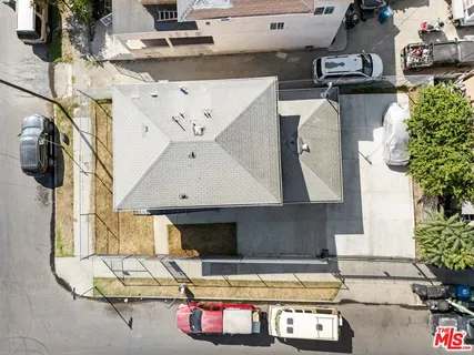 a living room with furniture and flowers