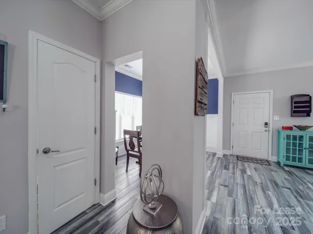 a view of entryway with wooden floor