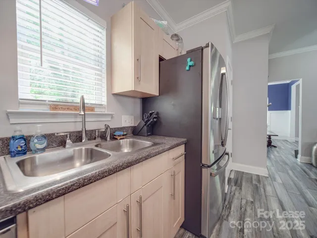 a kitchen with a sink and cabinets